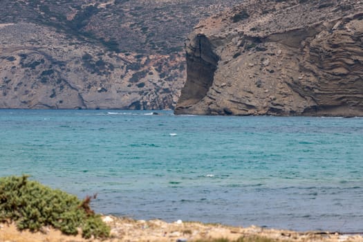 Coastline with rock formations protruding into the sea on the Prasonisi peninsula on the Greek island of Rhodes