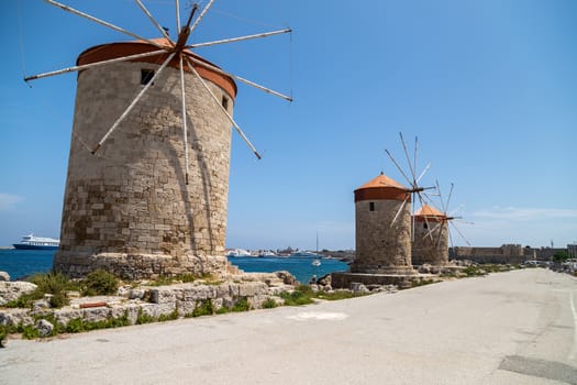 Old windmills at Mandraki  harbour in Rhodes city  on Rhodes island, greece  