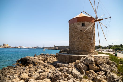 Old windmill at Mandraki  harbour in Rhodes city  on Rhodes island, greece  