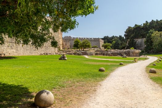 Along the ditch of the antique city wall in the old town of Rhodes city at greek island Rhodes on a sunny day in summer