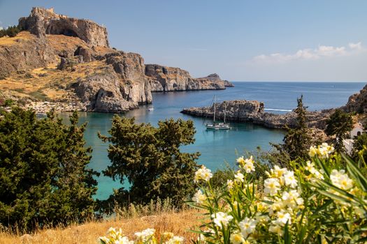 Scenic view at St. Pauls bay and the acropolis of Lindos on Rhodes island, Greece on a sunny day 
