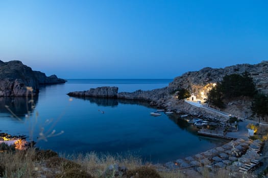 Scenic view at St. Pauls bay in Lindos on Rhodes island, Greece  during blue hour in the evening 