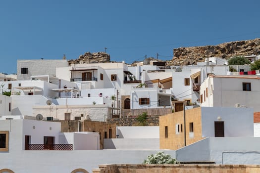 View at the city of Lindos on Greek island Rhodes with white houses on a sunny day in spring