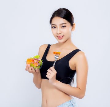 Beautiful portrait young asian woman smiling holding salad vegetable food isolated on white background, girl diet eating vegetarian for healthy, health care or wellness concept.