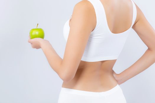 Back view portrait asian woman holding green apple fruit and beautiful body diet with fit isolated on white background, girl weight slim with cellulite or calories, health and wellness concept.