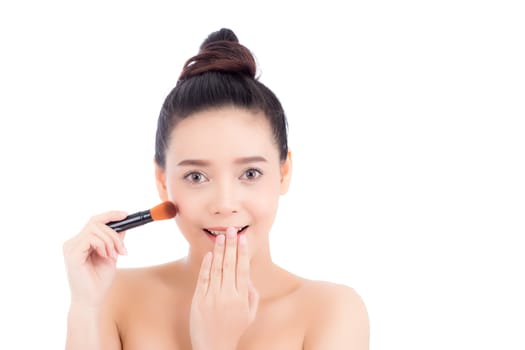 Beauty of portrait asian woman applying make up with brush of cheek isolated on white background, beautiful of girl holding blusher, skincare and cosmetic concept.