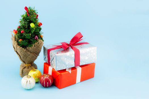 Many gift box white ribbon ball and tree isolated on blue background, using for christmas and new year or holiday other.