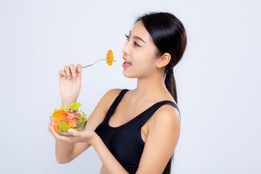 Beautiful portrait young asian woman smiling holding salad vegetable food isolated on white background, girl diet eating vegetarian for healthy, health care or wellness concept.