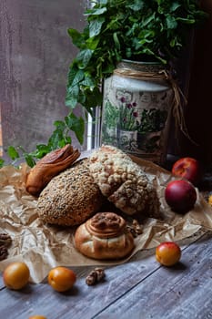 Different kinds of bread and fruits on a window