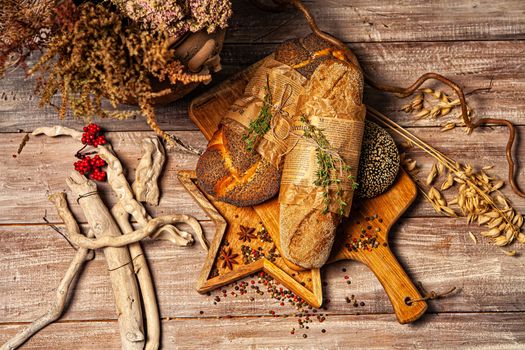 Different kinds of bread on a wooden desk