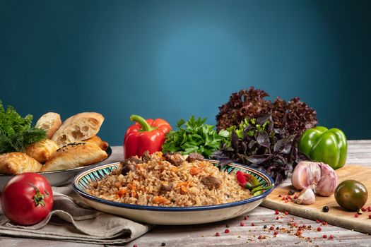 Asian traditional food and vegetables on an old wooden table