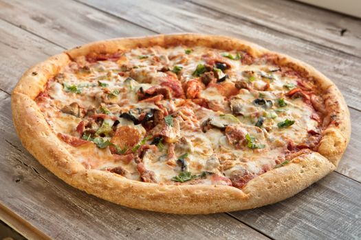 Pizza on an old wooden table