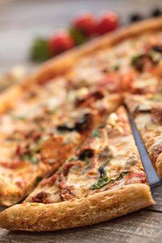 Pizza on an old wooden table