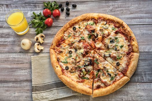 Pizza on an old wooden table