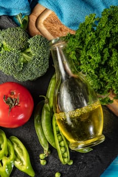 Sunflower and vegetables on an old wooden desk