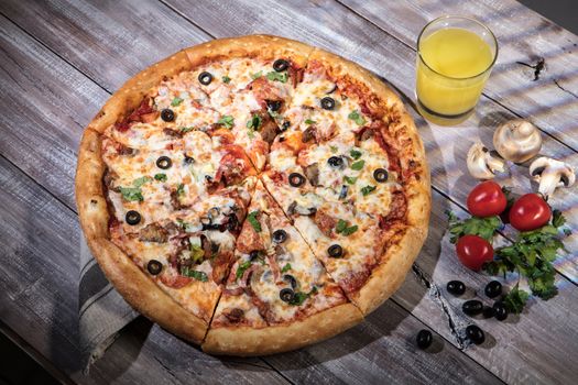 Pizza on an old wooden table