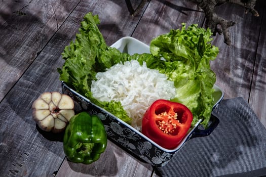 Cabbage and vegetables on a wooden background