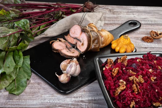 Meat and vegetables on an old wooden background