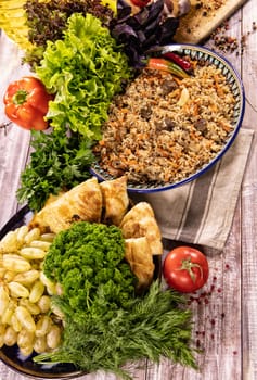 Traditional Asian food on an old wooden desk with different ingredients