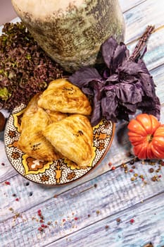 Traditional Asian food Samsa on an old wooden desk