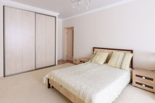 Interior of a spacious, light, cozy bedroom