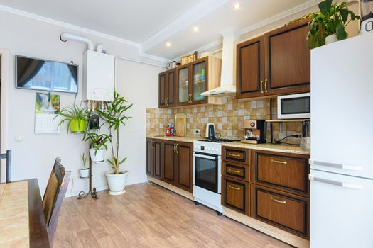 Kitchen set in a spacious living room and kitchen with an old classic wood design