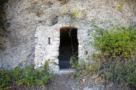 stone house carved into the white rock.