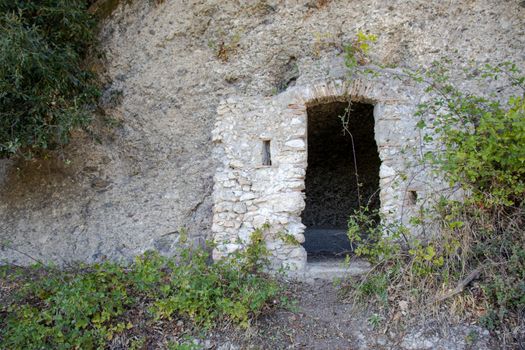 stone house carved into the white rock.