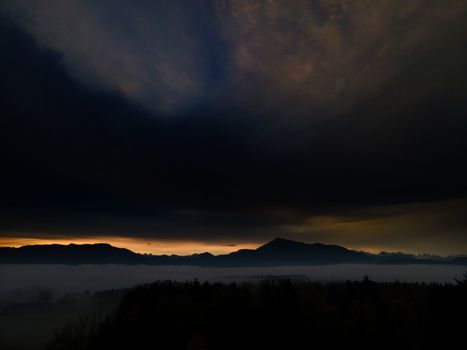 Panoramic foggy landscape with mountains in morning