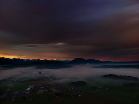 Panoramic foggy landscape with mountains in morning