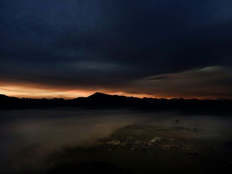 Panoramic foggy landscape with mountains in morning