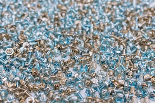 Lots of screws and bolts lying in a common unsorted pile