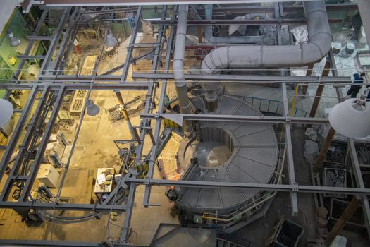 Rotating oven in lost wax casting foundry shop - view from above.
