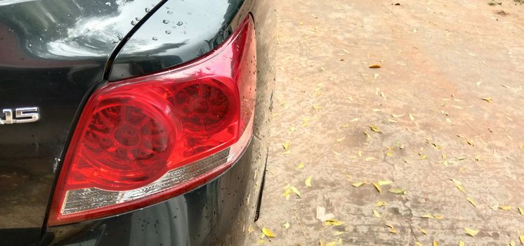 back light of black colored car on road