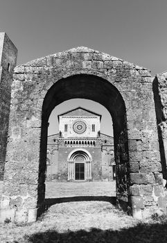 TUSCANIA-ITALY-August 2020 -view of San Pietro church ,beautiful rose window with mosaics ,animal reliefs and figures , black and white photography