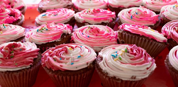 cupcake with strawberry icing on top