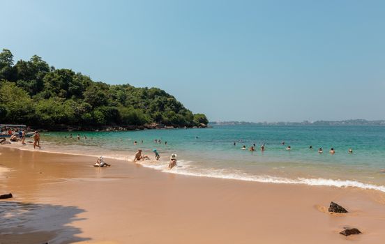 people sunbathing in Rumassala South Beach, is situated along with the Rumassala hill in Unawatuna. It is also known as Jungle Beach