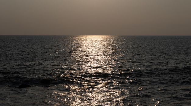 distance ocean sunset reflection on water landscape