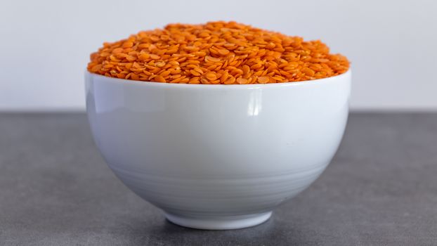 Bowl of Dhal seeds front view Neutral background with negative space to add caption