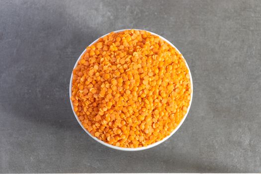 Bowl of Dhal seeds top view Neutral background with negative space to add caption