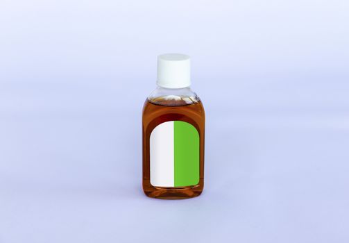 Small isolated Antiseptic Liquid bottle on a neutral background