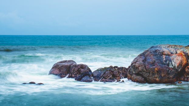 Long Exposure Ocean Waves hitting collection of rocks