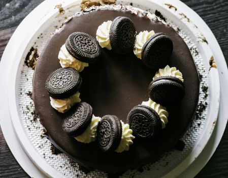 Chocolate Icing cake dark chocolate biscuits on topping view from top