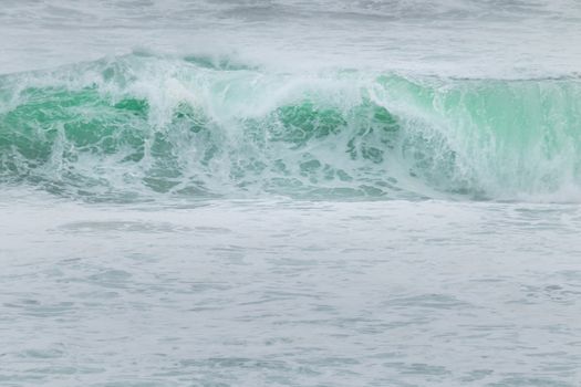 Tides crashing and splashing nice clear blue water in the Indian ocean.