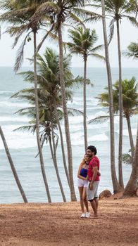 Weligama, Southern Province / Sri Lanka - 07 26 2020: young beautiful Sri Lankan Couple in Mirissa coconut tree hill.