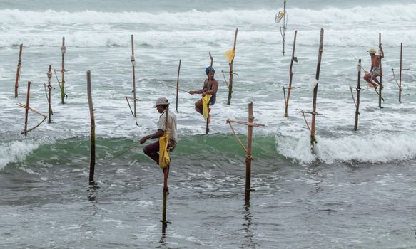 Weligama, Southern Province / Sri Lanka - 07 26 2020:Stilt fishermen beautiful scenery in southern Sri Lanka.