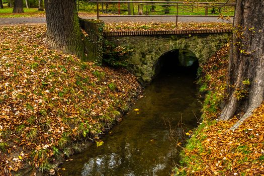 Tunnel in the park crossed by a stream in Park Letna, czech Republic