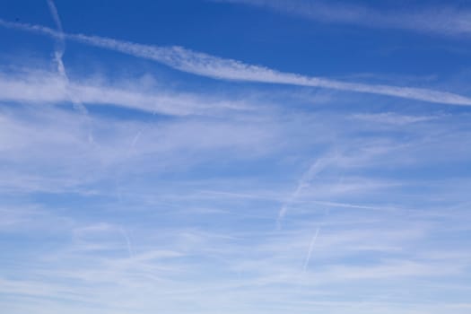 White clouds and stripes in the blue sky