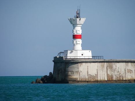 Lighthouse on the shore in Sevastopol. Lighthouse on the Black Sea.