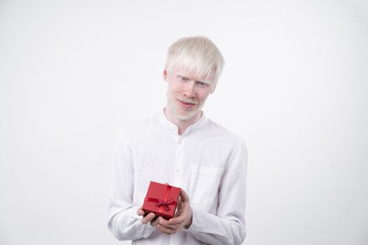 albinism albino man in studio dressed t-shirt isolated on a white background. abnormal deviations. unusual appearance. skin abnormality